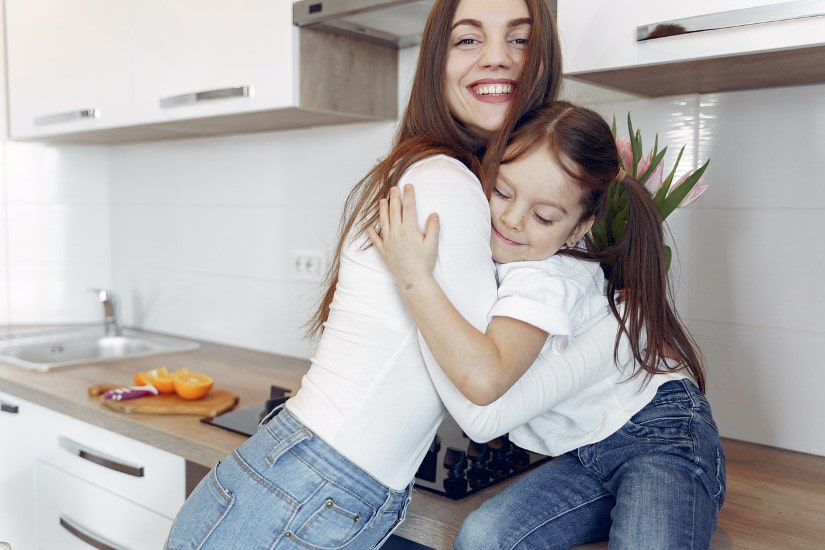 Mom and daughter hugging